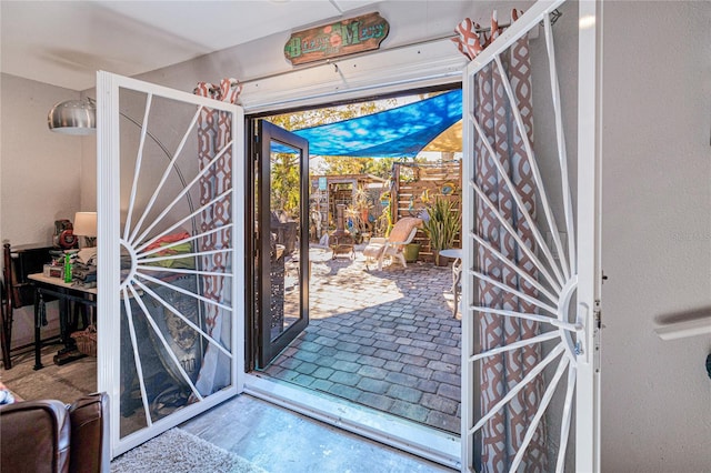 doorway to outside with concrete flooring