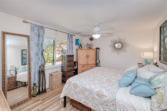 bedroom featuring light wood-type flooring and ceiling fan