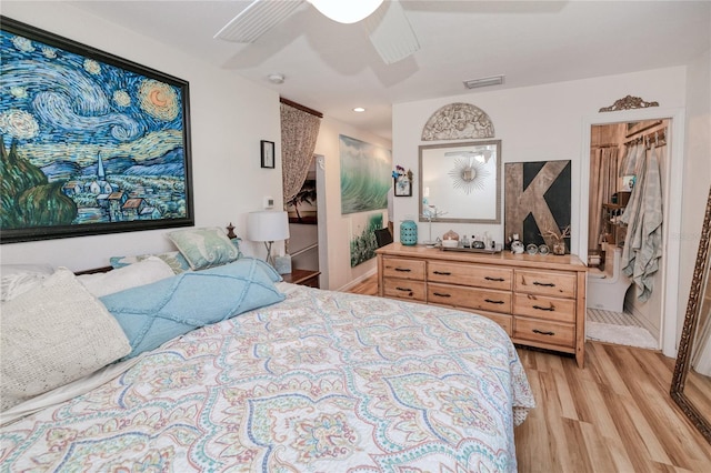 bedroom featuring a closet, ceiling fan, and light hardwood / wood-style flooring