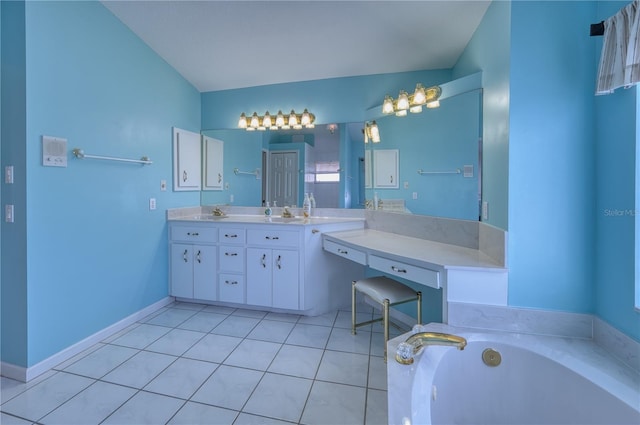 bathroom featuring tile patterned flooring, vanity, and a tub to relax in