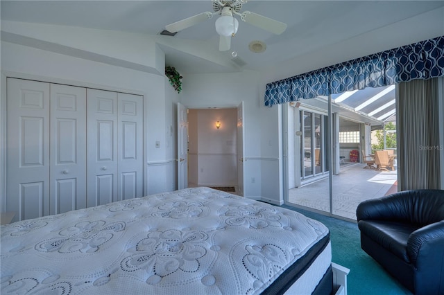 bedroom with a closet, carpet floors, and vaulted ceiling