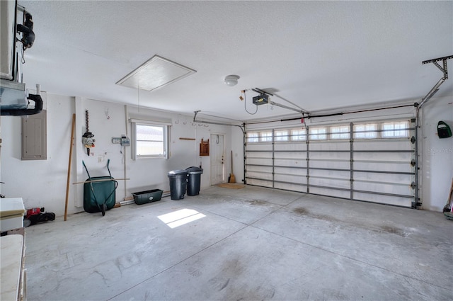 garage with electric panel and a garage door opener