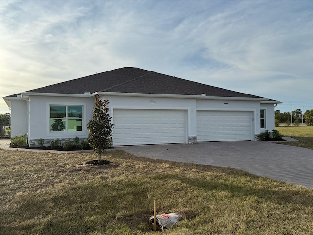 view of property exterior with a garage and a yard