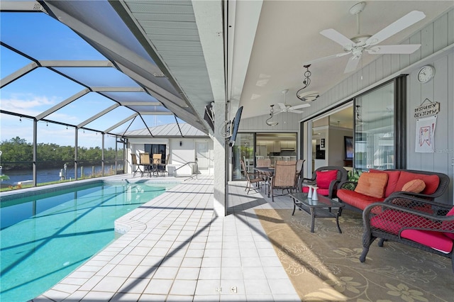 view of swimming pool with a patio area, an outdoor living space, ceiling fan, and glass enclosure