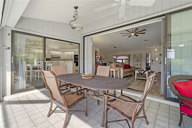 sunroom / solarium with ceiling fan