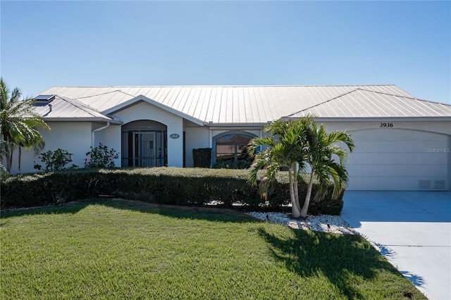 ranch-style house with a garage and a front lawn