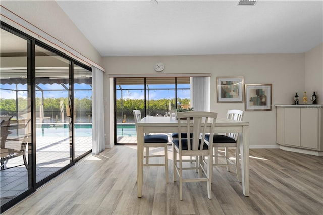 dining space featuring light hardwood / wood-style flooring