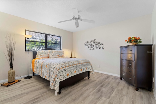 bedroom featuring ceiling fan and light wood-type flooring