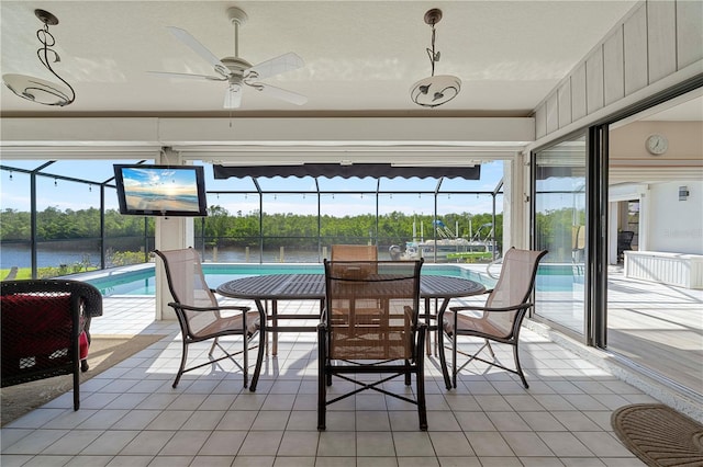 sunroom / solarium with plenty of natural light and ceiling fan