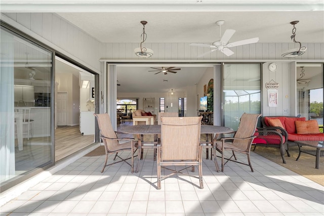 interior space with ceiling fan, plenty of natural light, vaulted ceiling, and light wood-type flooring