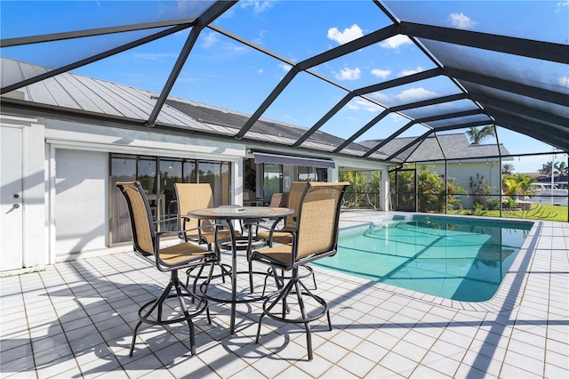 view of swimming pool with a lanai and a patio