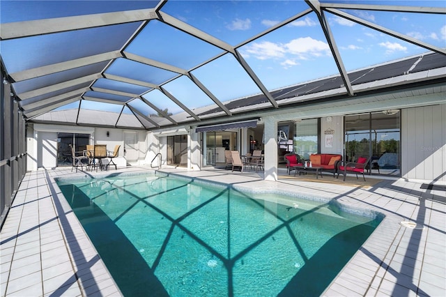 view of swimming pool with an outdoor living space, a lanai, and a patio