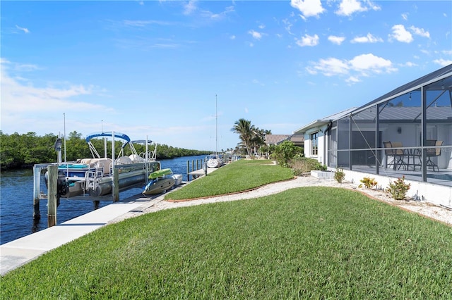 view of dock with a yard, a water view, and glass enclosure