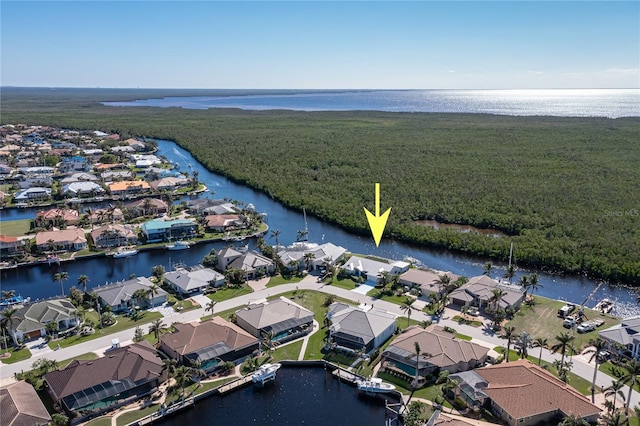 birds eye view of property featuring a water view