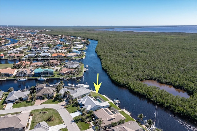 bird's eye view with a water view