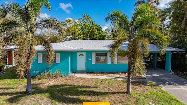 view of front of home with a carport