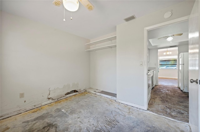 interior space featuring ceiling fan, white refrigerator, and a closet