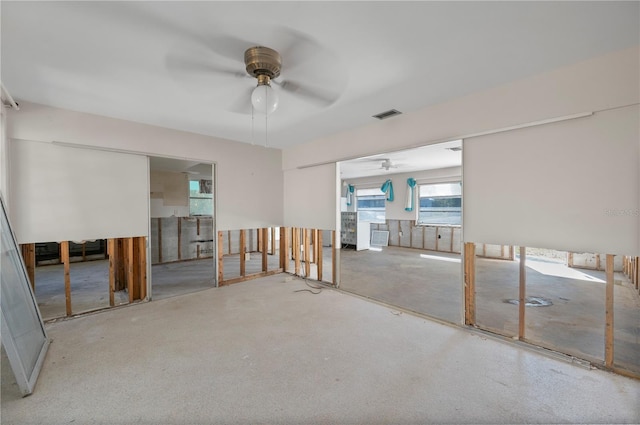 unfurnished room with ceiling fan