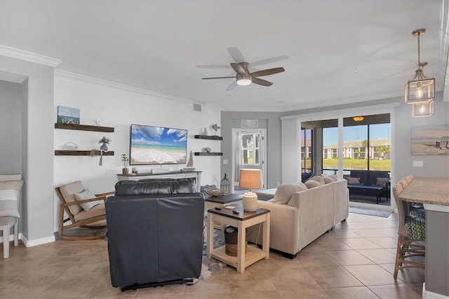 living room featuring ceiling fan, light tile patterned floors, and ornamental molding