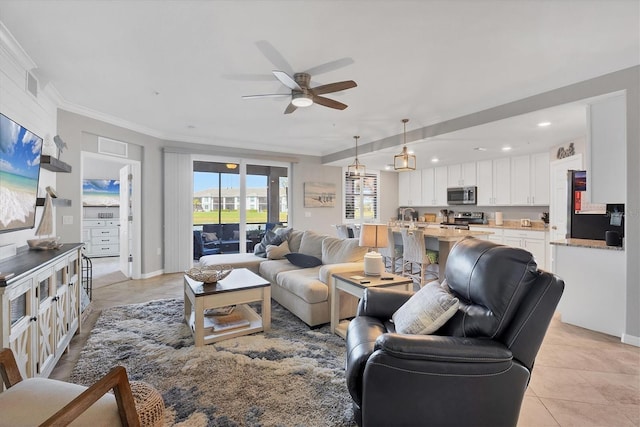 tiled living room featuring ceiling fan and ornamental molding