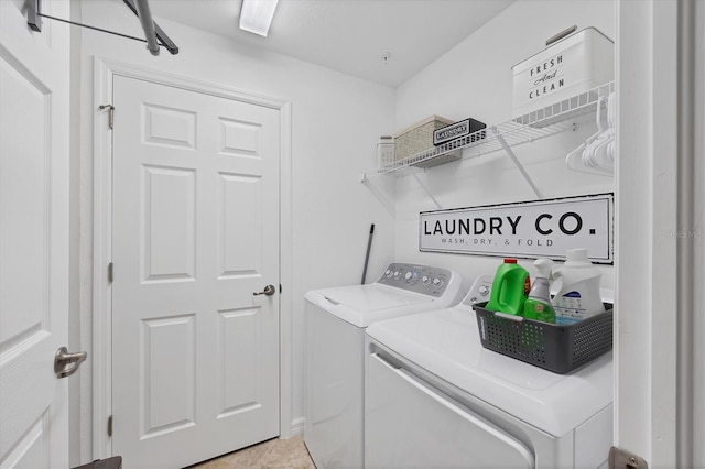 laundry area with tile patterned floors and washer and clothes dryer