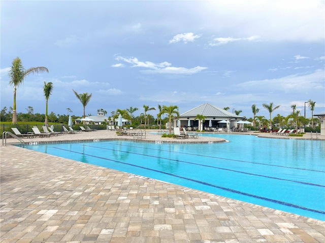 view of swimming pool featuring a patio