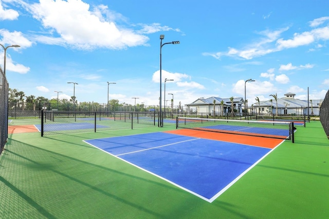 view of sport court with basketball hoop