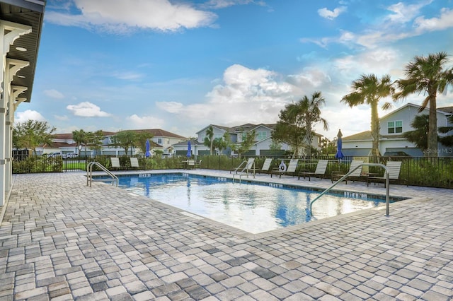 view of swimming pool featuring a patio area