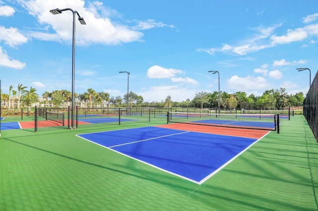 view of tennis court featuring basketball court