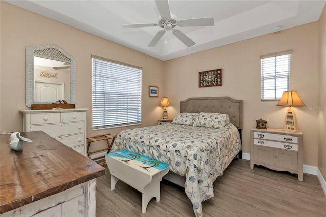 bedroom featuring ceiling fan and light hardwood / wood-style flooring