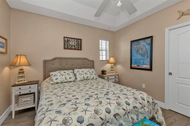 bedroom featuring hardwood / wood-style floors and ceiling fan