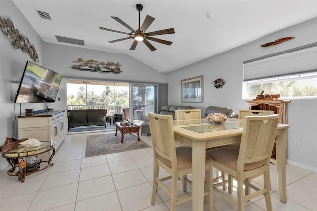 tiled dining room featuring ceiling fan and lofted ceiling