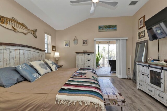 bedroom featuring access to outside, multiple windows, ceiling fan, and light wood-type flooring