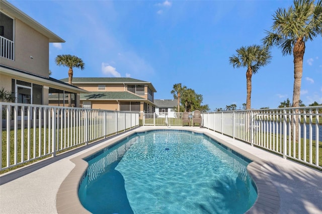 view of pool featuring a water view