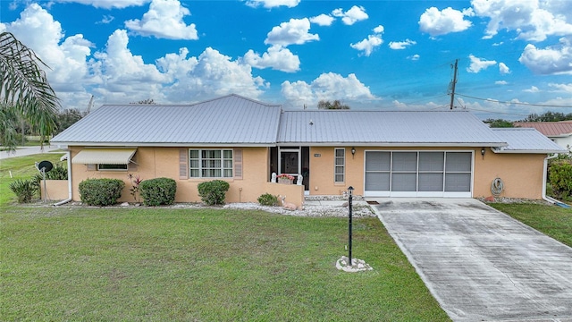 ranch-style home with a front lawn and a garage