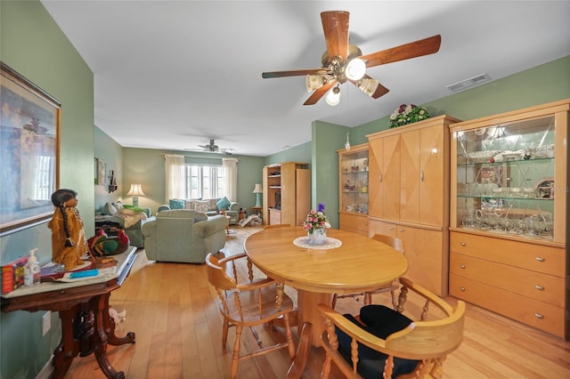 dining room featuring ceiling fan and light wood-type flooring