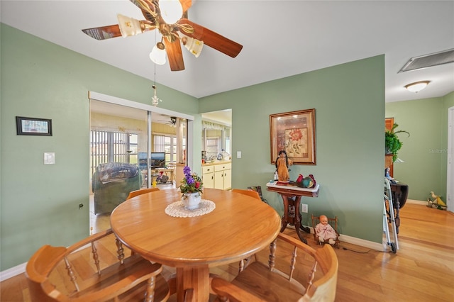 dining room featuring light hardwood / wood-style floors and ceiling fan