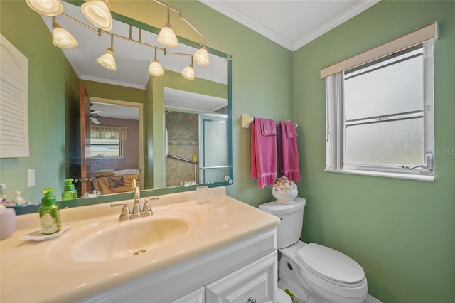 bathroom with plenty of natural light, crown molding, and vanity