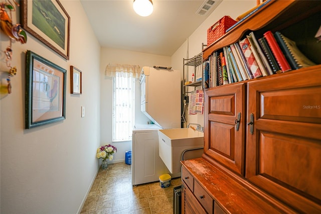 washroom featuring independent washer and dryer