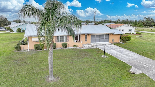 ranch-style home with a front yard and a garage