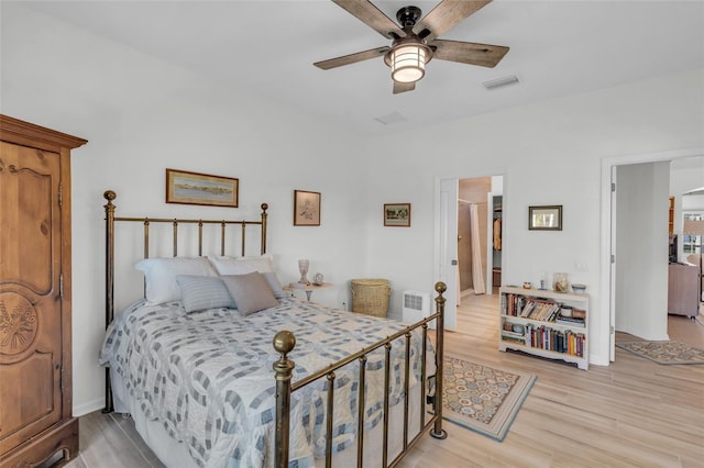 bedroom with light wood-type flooring and ceiling fan