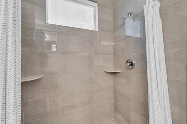 bathroom featuring a shower with curtain