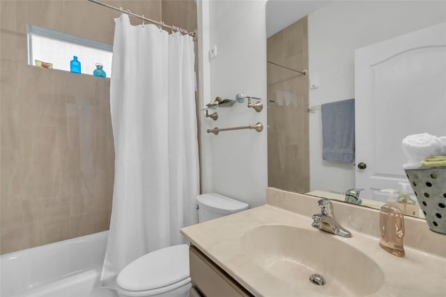 full bathroom featuring vanity, shower / bath combo, and toilet