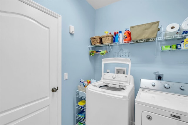 clothes washing area featuring washing machine and dryer