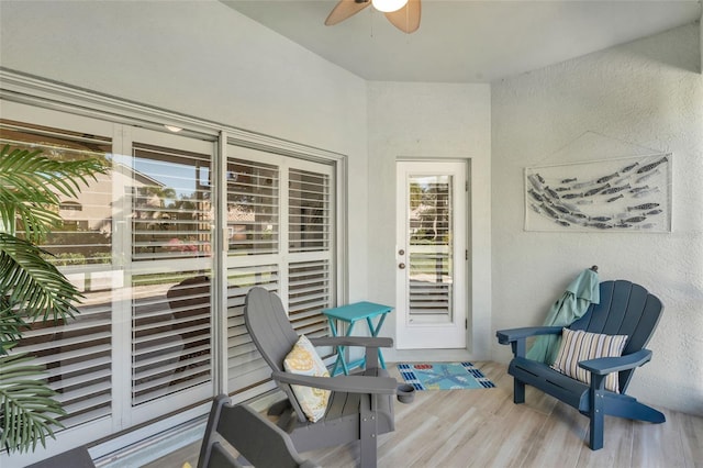 interior space with ceiling fan