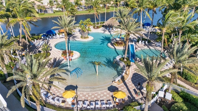 birds eye view of property with a water view