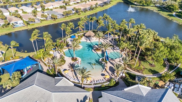 birds eye view of property with a water view