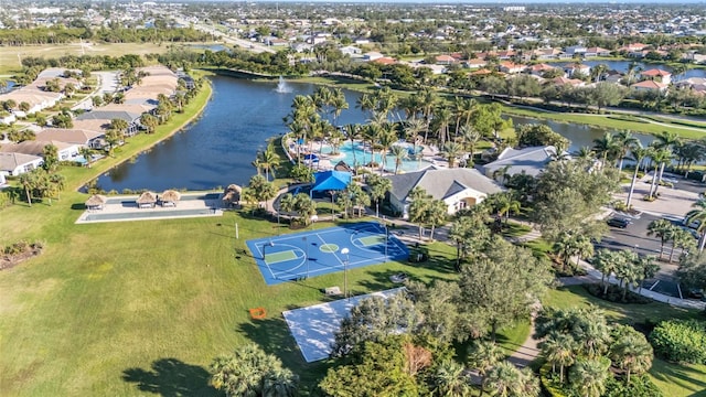 birds eye view of property with a water view