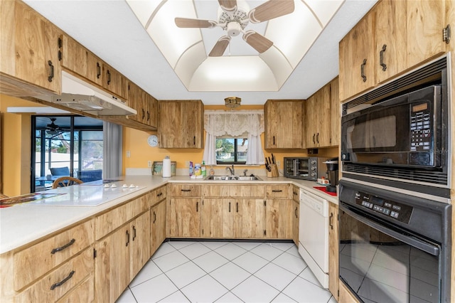 kitchen featuring sink, light tile patterned flooring, and black appliances