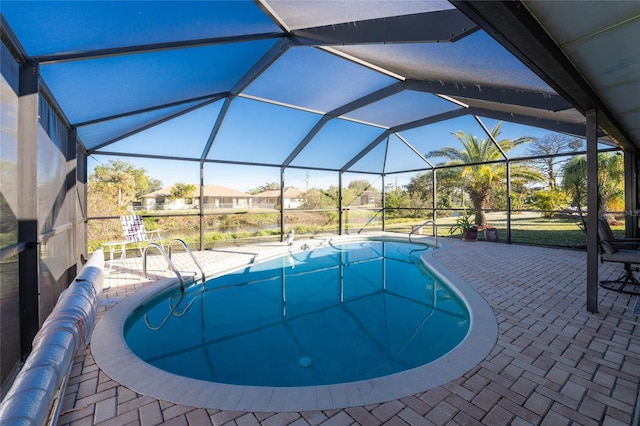 view of pool with a lanai and a patio area